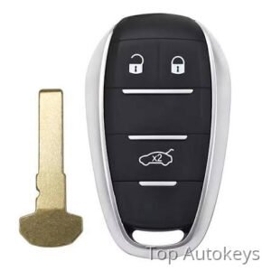 Car remote key fob with three buttons and a separate gold metal key blade left of it