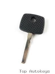 Car key with black textured head and metal blade on a white background.