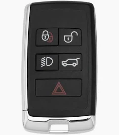 Black car key fob showing four function buttons: lock, unlock, headlights, and open trunk, with a red hazard button below.